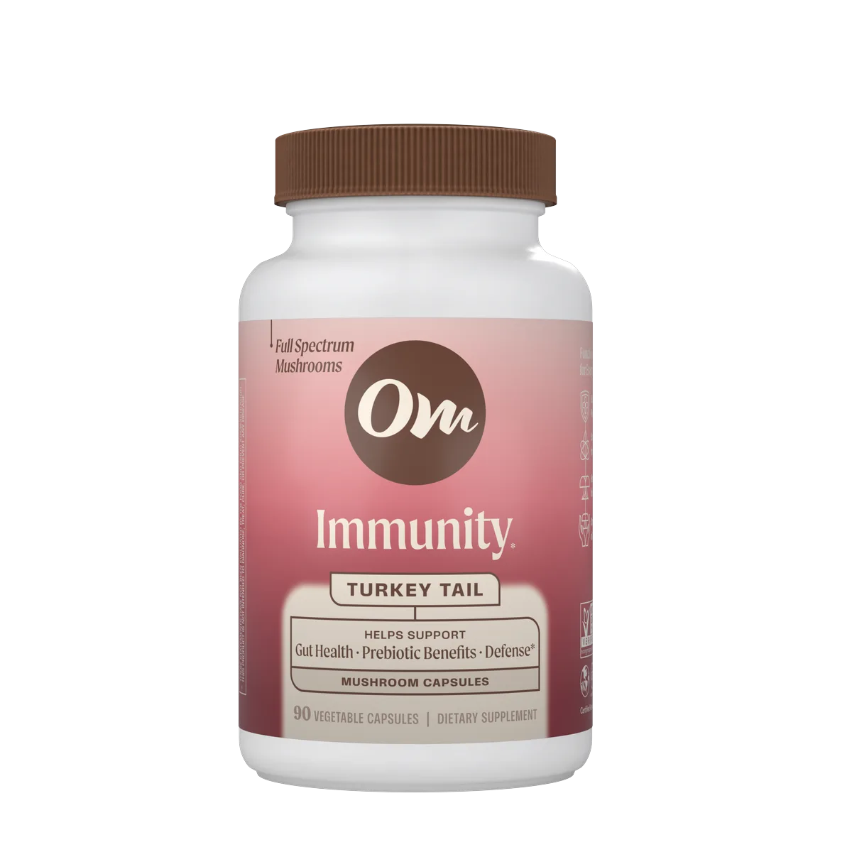 Om Immunity Turkey Tail capsules in front of a Turkey Tail mushroom