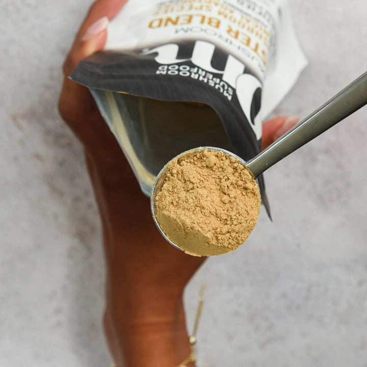 Scoop of plant-based protein powder.