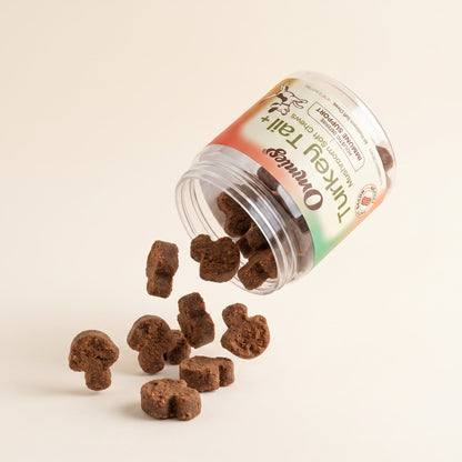 Ommies soft chews falling from the jar